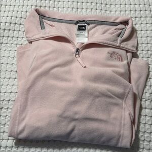 The North Face Light Pink Fleece Pullover. Fits more like a medium/large.